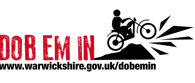 Dob em in logo of person on bike riding off ramp